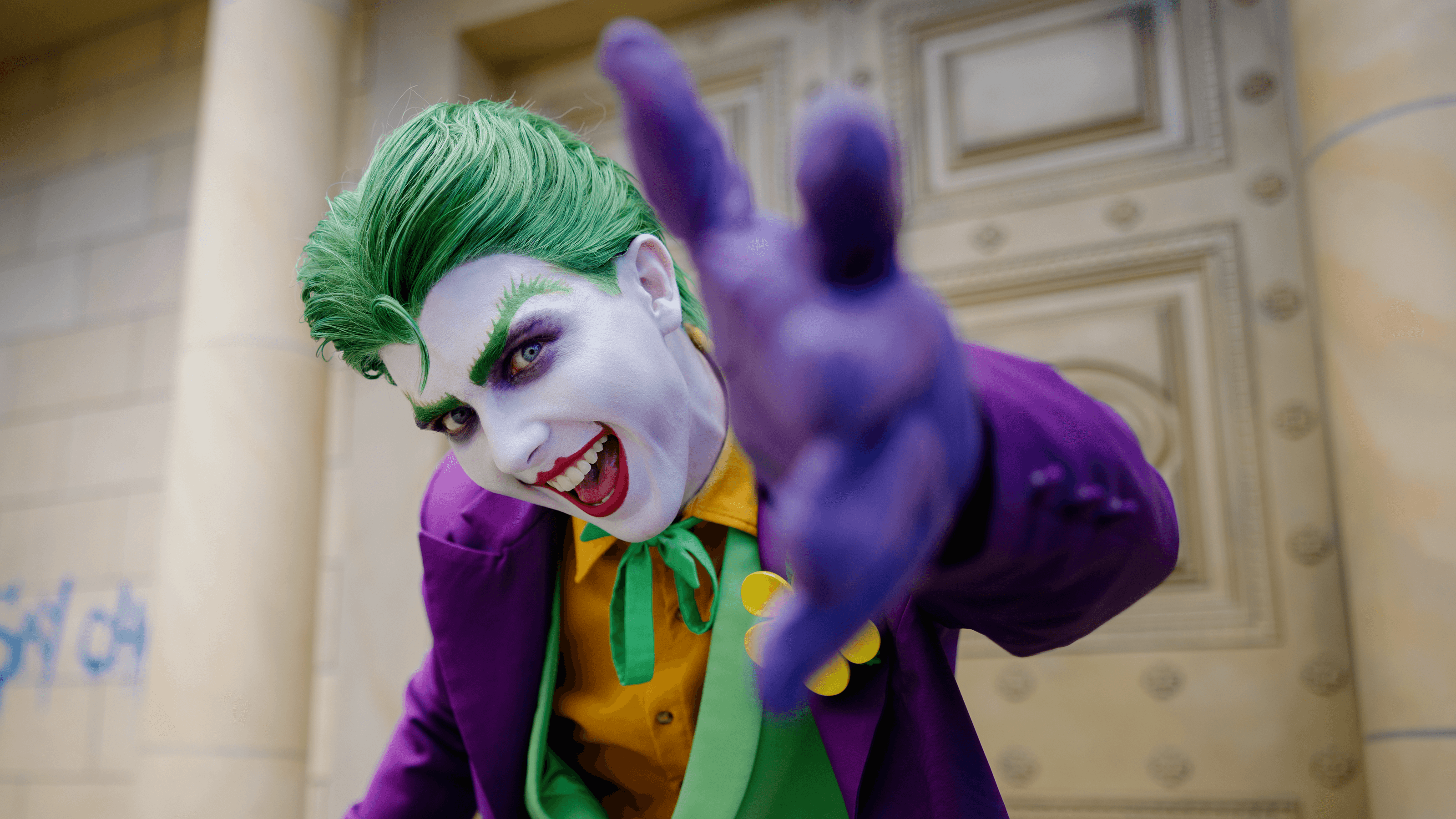 A close-up of The Joker, the iconic supervillain character, at Warner Bros. Movie World, showcasing his mischievous grin and distinctive features